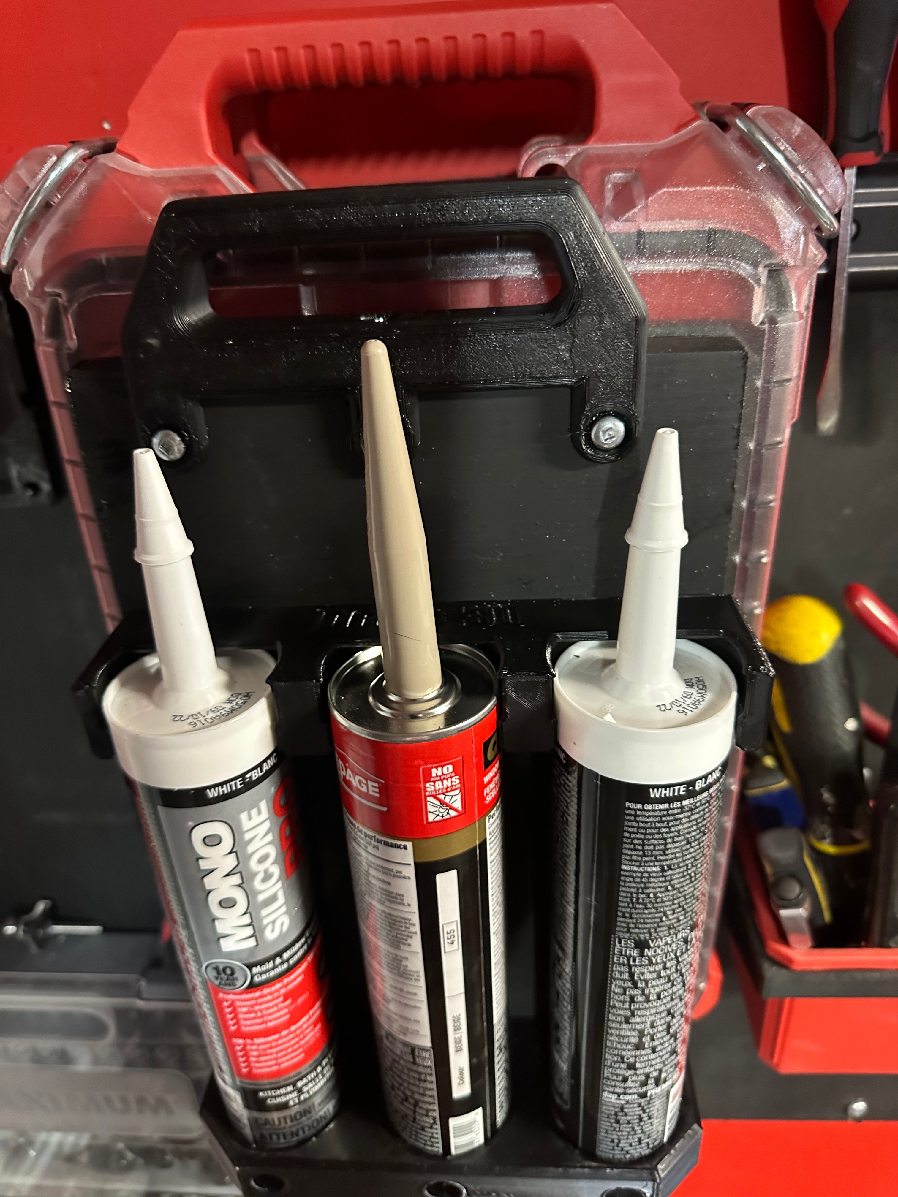 Packout compatible caulking tube holder